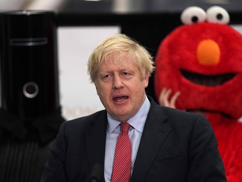 Prime Minister Boris Johnson with fellow candidates Elmo and Lord Buckethead in his constituency.