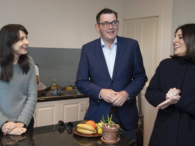 Victorian Premier Daniel Andrews and minister Marlene Kairouz (r) with renter Elizabeth Watt.
