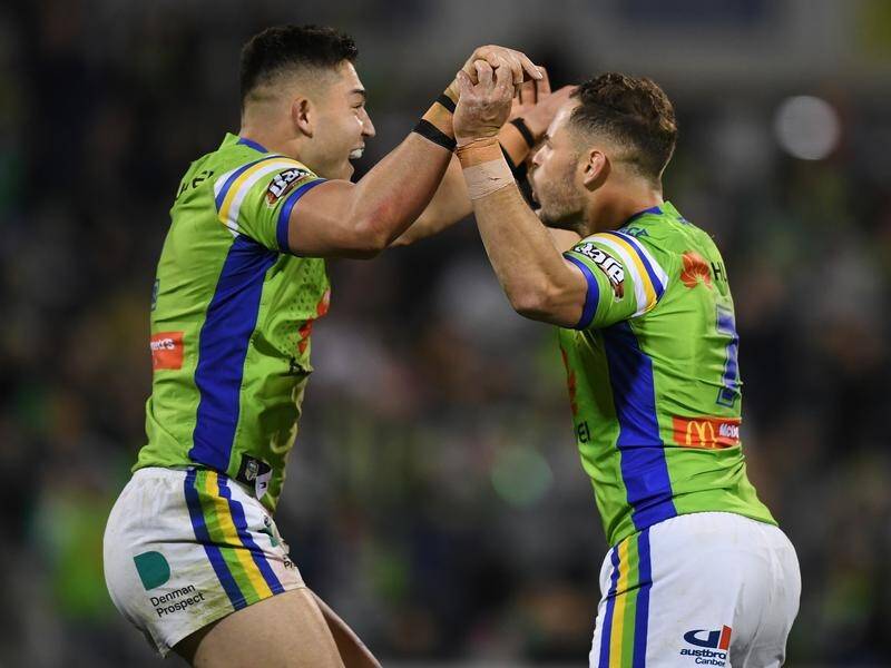 Canberra's Nick Cotric (l) has been declared the best winger in the NRL by his coach Ricky Stuart.