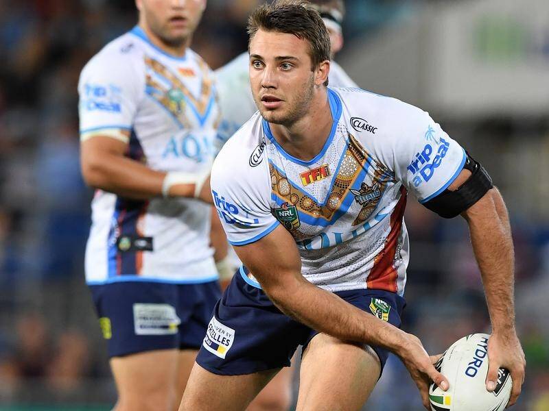 Gold Coast utility Karl Lawton has signed a two-year deal with NRL rivals the Warriors.