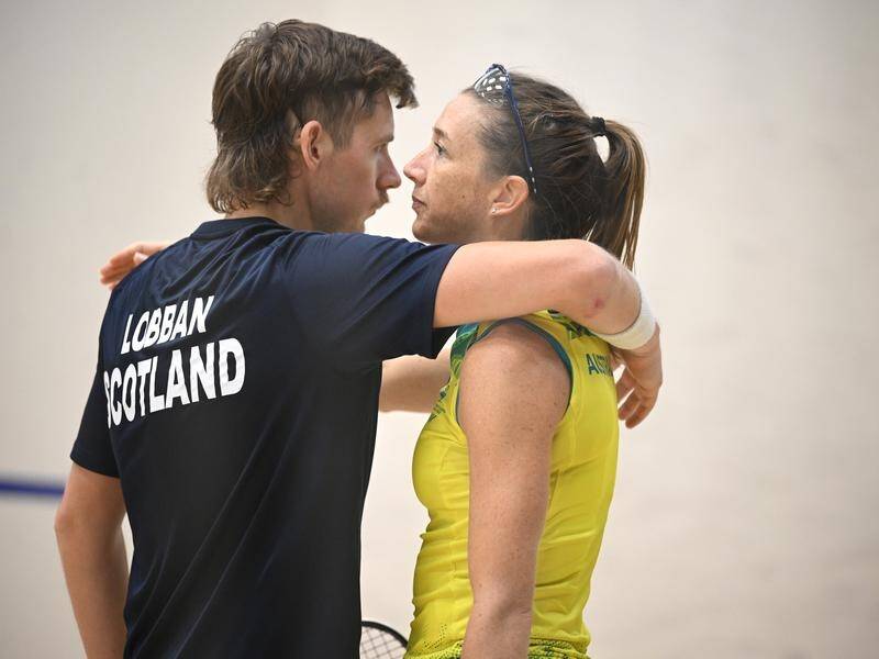 Scot Greg Lobban hugs Australian wife Donna during their Commonwealth mixed doubles quarter-final. (James Ross/AAP PHOTOS)