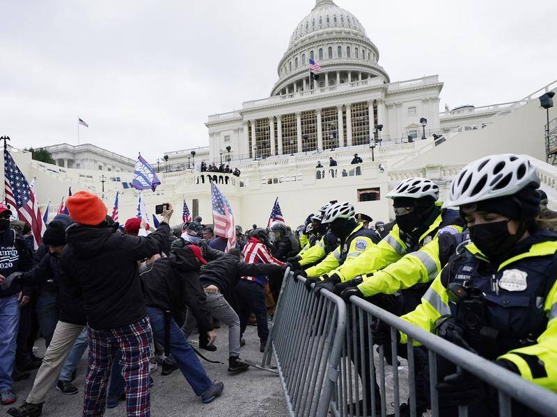 Pro-Trump protesters have stormed the US Capitol building, forcing evacuations and clashes.