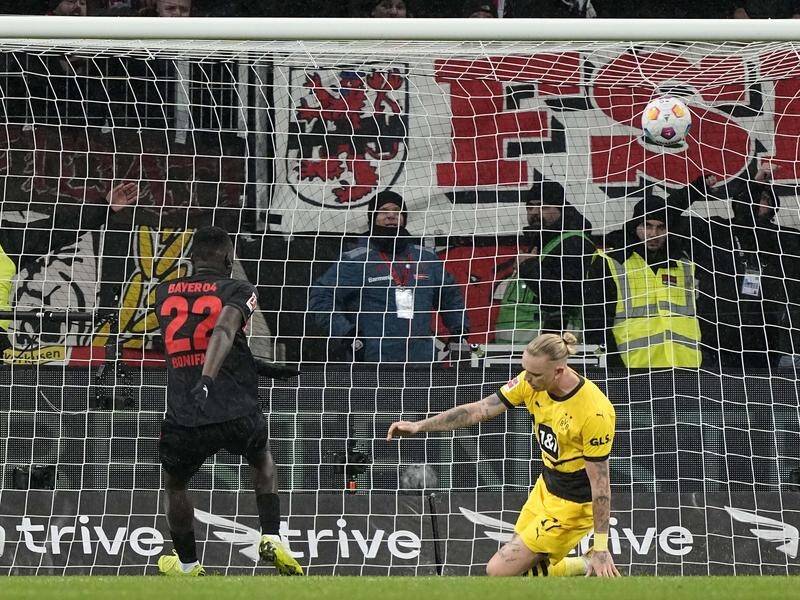 Victor Boniface (22) nets his late leveller for Leverkusen at home to Borussia Dortmund. (AP PHOTO)