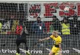 Victor Boniface (22) nets his late leveller for Leverkusen at home to Borussia Dortmund. (AP PHOTO)