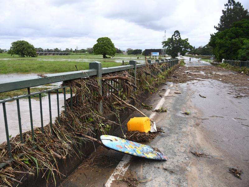 Heavy rains that have lashed Queensland in the wake of ex-cyclone Kirrily are heading to NSW. (Jono Searle/AAP PHOTOS)