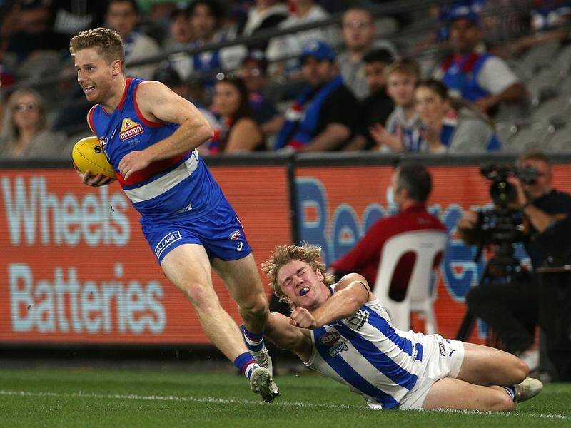 Lachie Hunter (l) will return for the Western Bulldogs against Brisbane on Thursday night.