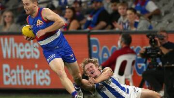 Lachie Hunter (l) will return for the Western Bulldogs against Brisbane on Thursday night.