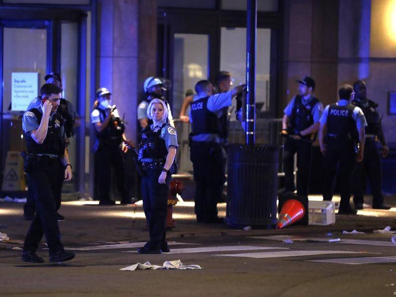 At least 13 police officers have been injured in clashes with looters in Chicago.