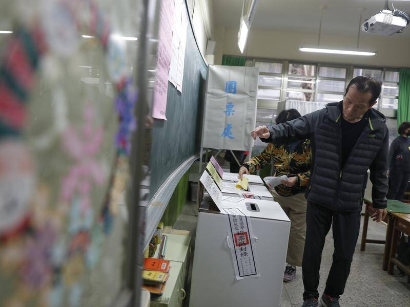 Taiwanese cast their votes on whether to let Tsai's pro-independence party have a second term.