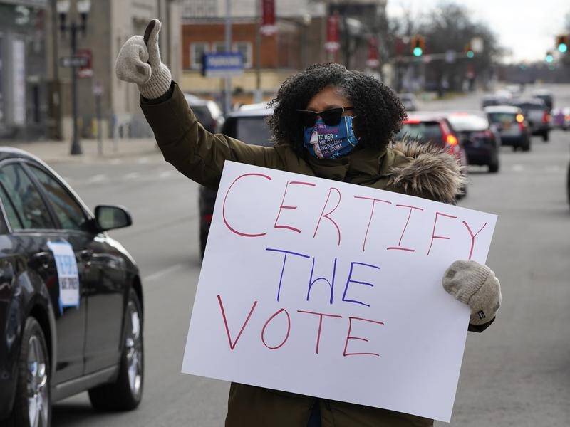 Protesters gathered in Lansing as Michigan officials certified the state's election results.