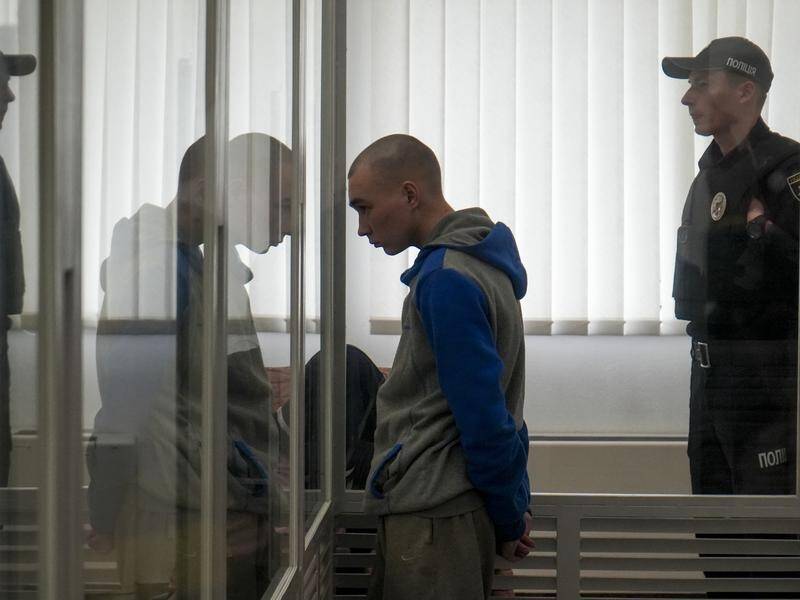 Russian soldier Vadim Shishimarin stands in court during this week's war crimes trial in Ukraine.