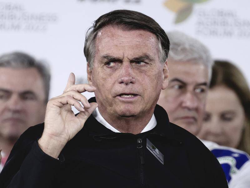 Jair Bolsonaro has called the legitimacy of Brazil's electronic voting system into question. (AP PHOTO)