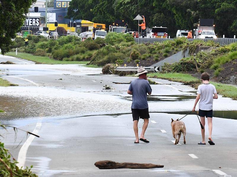 Flood-hit regions in Queensland are bracing for another drenching from ex-Tropical Cyclone Kirrily. (Jono Searle/AAP PHOTOS)