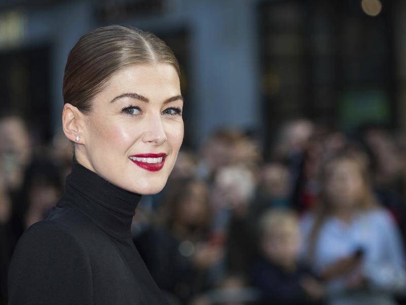 Rosamund Pike says playing war correspondent Marie Colvin in A Private War has been "gratifying".