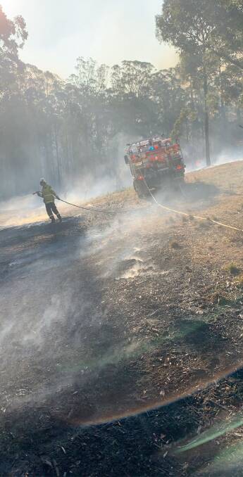 Marrangaroo rural bush fire brigade members as they work to contain a blaze near Taree. Picture: MARRANGAROO RFS. 