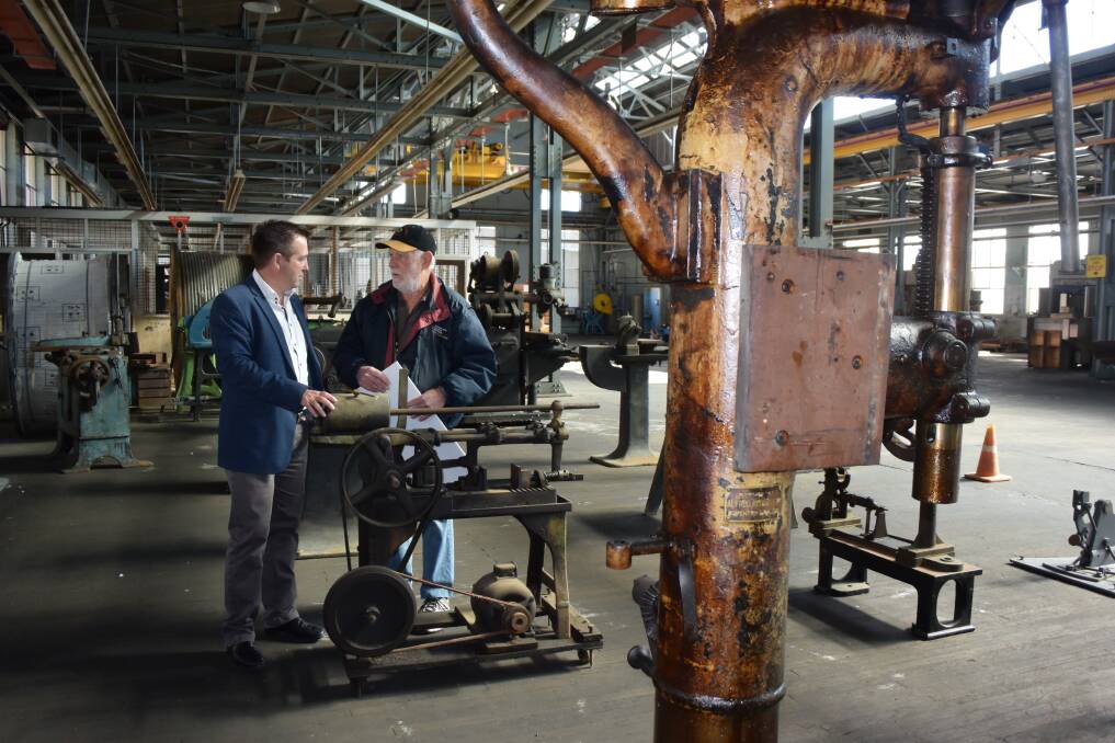 JUST THE SHOT: Bathurst MP Paul Toole tours the factory with Lithgow Small Arms Factory Museum secretary Kerry Guerin. Photos: KIRSTY HORTON