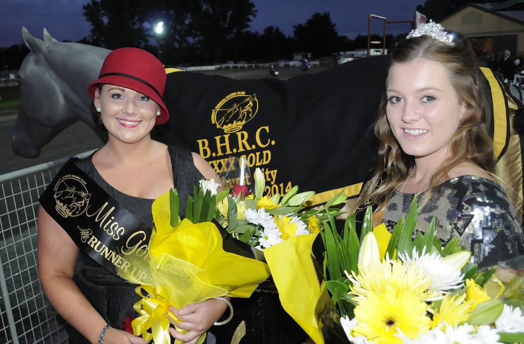 TRACKSIDE: Miss Gold Crown runner-up Georgie Townsend with Miss Gold Crown Monique Ryan at the Bathurst Gold Crown finals. Photo: CHRIS SEABROOK. 032914crown18