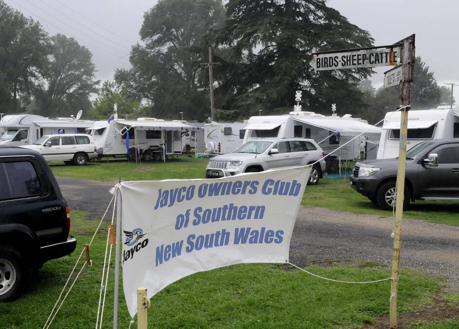 WHEELS DEAL: More than 120 caravans with 250 people converged on Bathurst Showground for the NSW Association of Caravan Clubs meeting. It wasn’t the best weather for them, though. Photo: CHRIS SEABROOK 030514caravns1