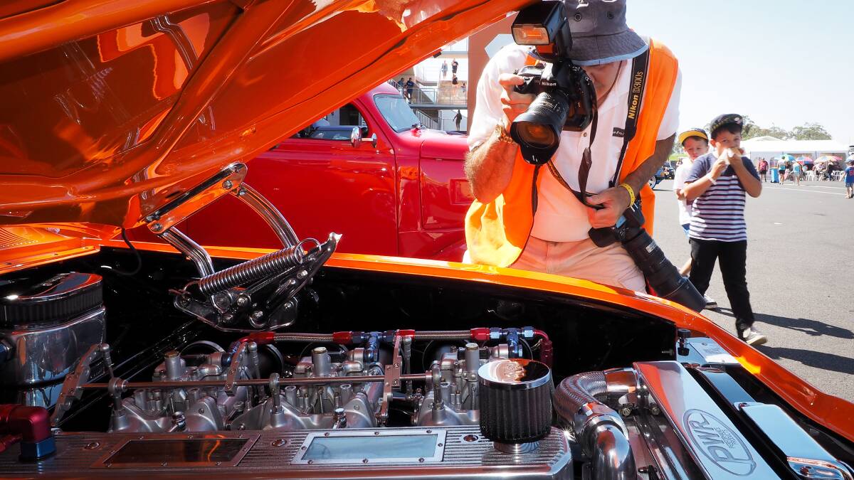 CLOSER LOOK: Mild-mannered Bathurst Regional Council employee during the week, revhead by weekend ... Western Advocate photographer ZENIO LAPKA found Grant Paterson checking out one of the six-cylinder power plants at the Bathurst
Autofest on Sunday. 030914zauto-7 