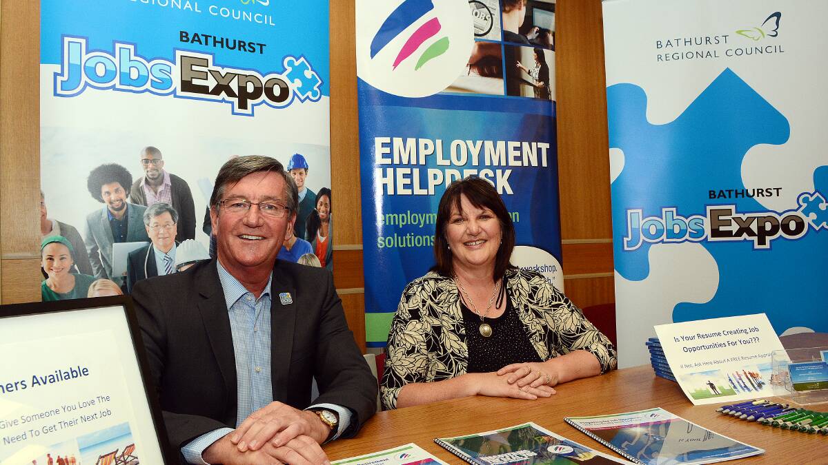 ON THE JOB: Bathurst mayor Gary Rush and Robyn Harrison getting ready for the Jobs Expo at Bathurst Memorial Entertainment Centre later this month. Photo: PHILL MURRAY	 110614pjobs