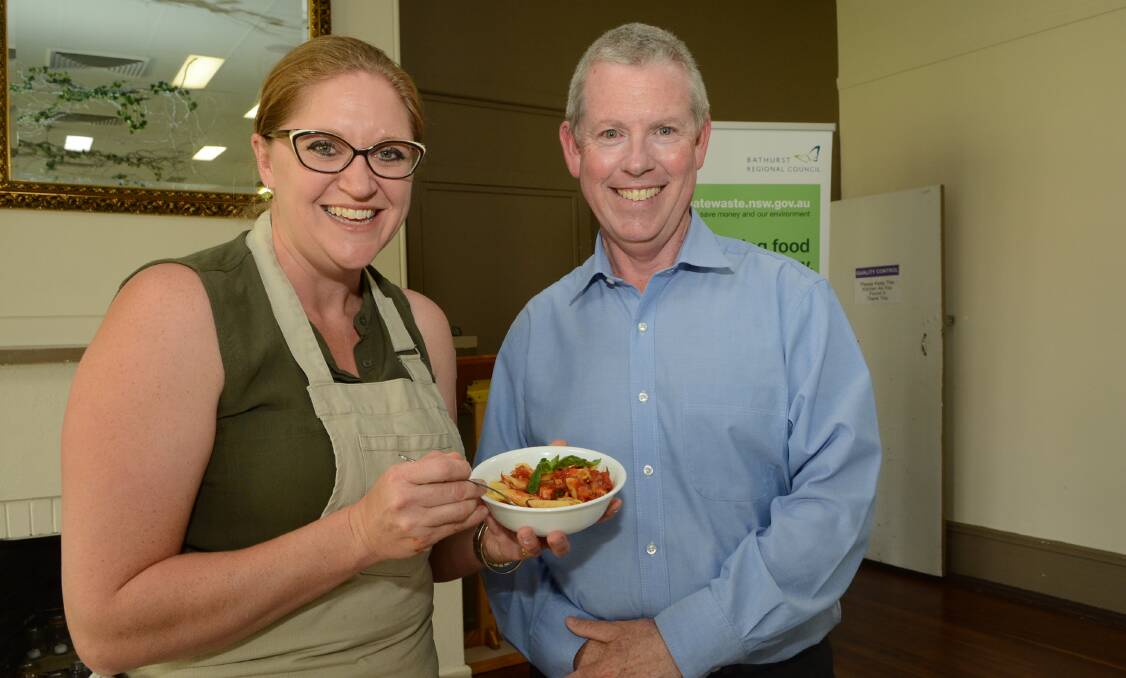 FOOD FOR THOUGHT: MasterChef winner Kate Bracks treats Bathurst Regional Council engineer Russell Deans to one of her pasta meals at yesterday’s demonstration. Photo: PHILL MURRAY	 112615pkate
