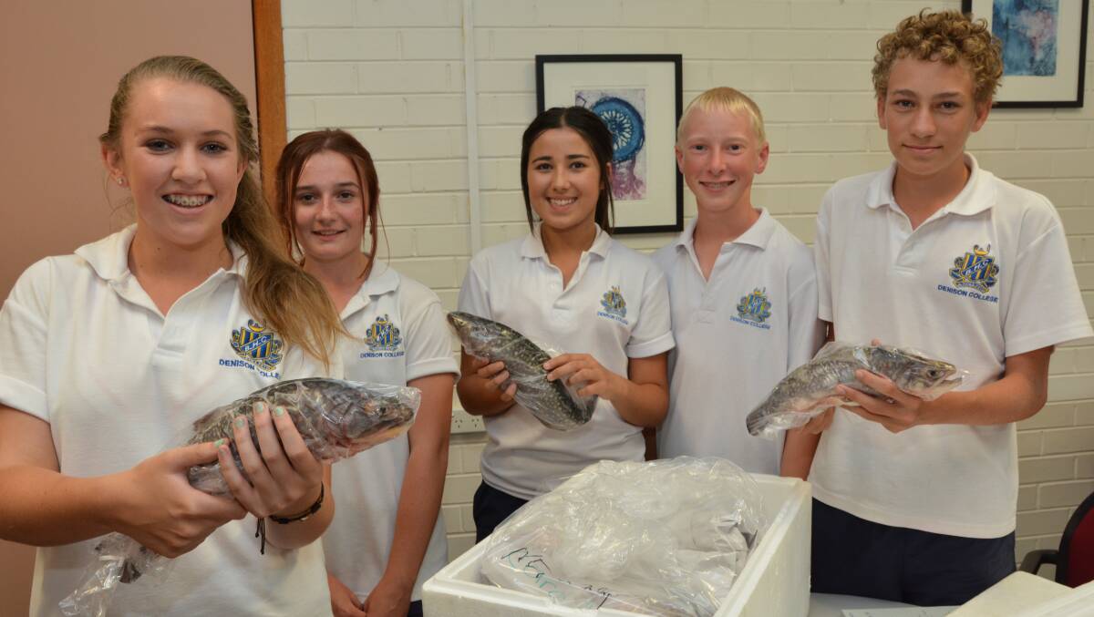 SOMETHING FISHY: Bathurst High students Lillian Stocks, Simone Roberts, Junaya Ireland, Matthew McCauley and Tom Lindsay proudly show off some of the brook trout they have farmed. Photo: ZENIO LAPKA 	021815ztrout