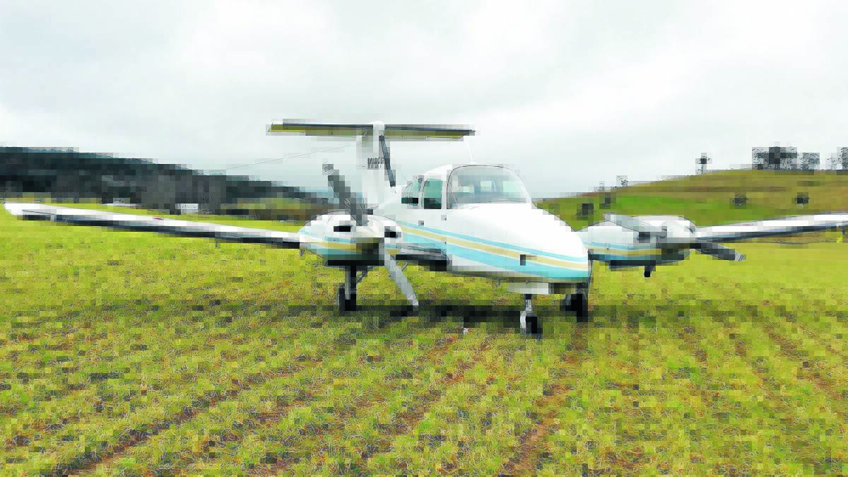 MAN CHARGED: The small aircraft that made an emergency landing near Oberon on Monday.