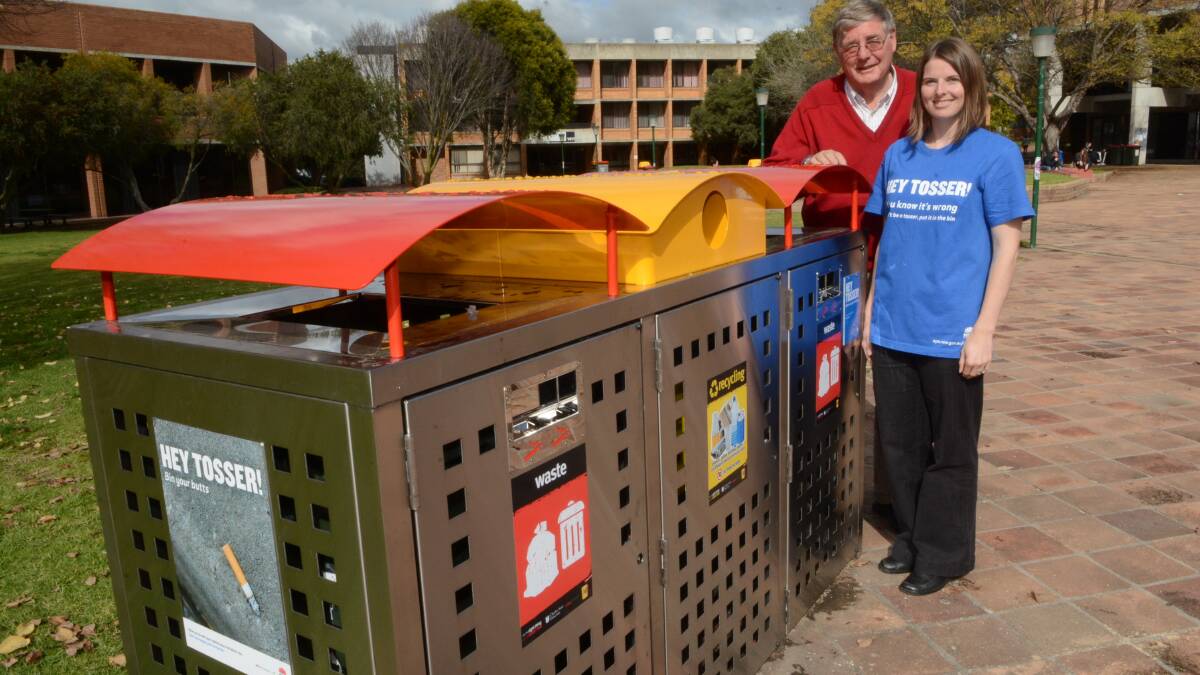 HEY TOSSER!: Charles Sturt University’s sustainability officer Alesha Elbourne and client service co-ordinator Alistair Robinson are encouraging people to speak up about littering. Photo: PHILL MURRAY	 052115pbins