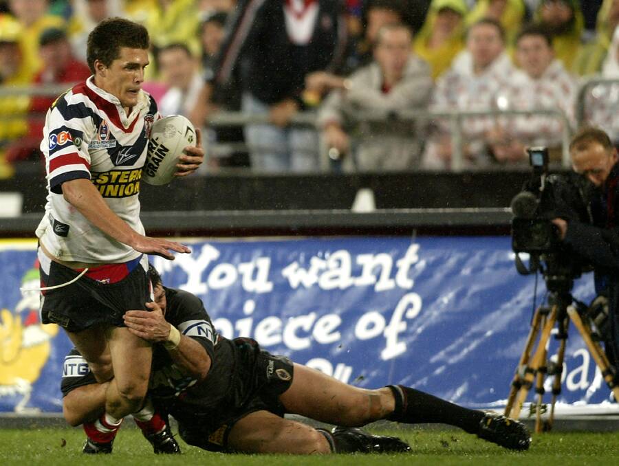 THAT TACKLE: Scott Sattler tackles Todd Byrne in the iconic moment of the 2003 NRL grand final. The brilliant covering tackle helped Sattler and his Penrith team-mates to an 18-6 victory. This Saturday Sattler will be in Bathurst in his capacity as the Northern Rivers representative coach. Photo: GETTY IMAGES 	052615sattler