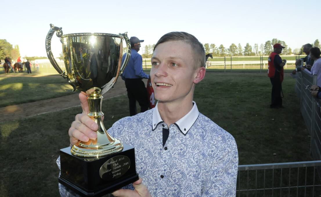 DENIED: Blaike McDougall, pictured with the Soldier’s Saddle Cup, rode Showmaster to victory on Monday and in the process condemned Bathurst trainer Peter Stanley to a second place finish in the feature for a the second year running. Photo: CHRIS SEABROOK 	042516cssadle2