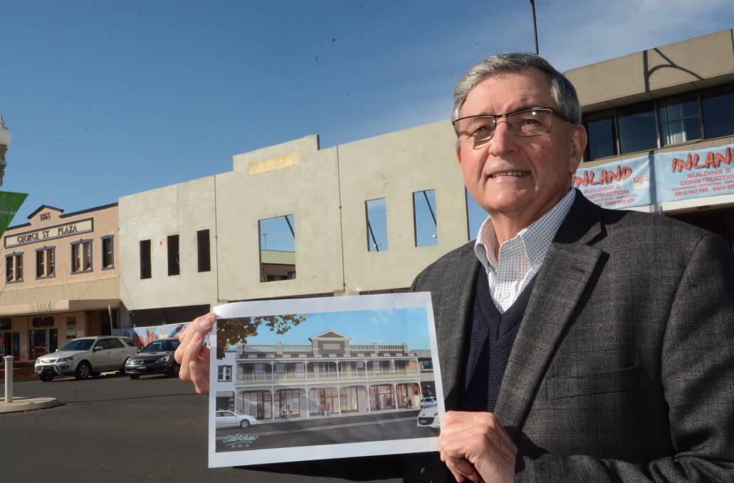 GOING UP: Developer Bruce Bolam with an artist’s impression of his new building in George Street which is going up behind him.  Photo: PHILL MURRAY