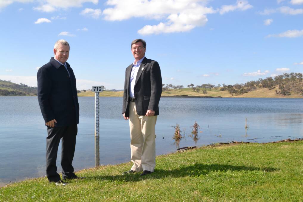 GOOD SIGN: Water and waste manager Russell Deans and mayor Gary Rush say Chifley Dam is at full capacity leading up to summer. Photo: NADINE MORTON 	091614nmchifley3