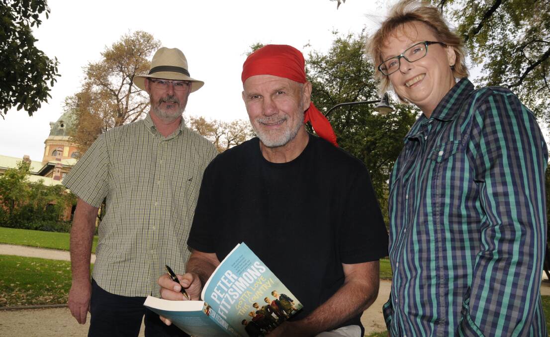RECOGNITION: Author Peter FitzSimons (centre) has included a story about former Bathurst man Mark Crennan in his latest book. Mr FitzSimons is pictured with Mark’s father Paul Crennan and Kathy Woolley. Photo: CHRIS SEABROOK 032816cpfitz4