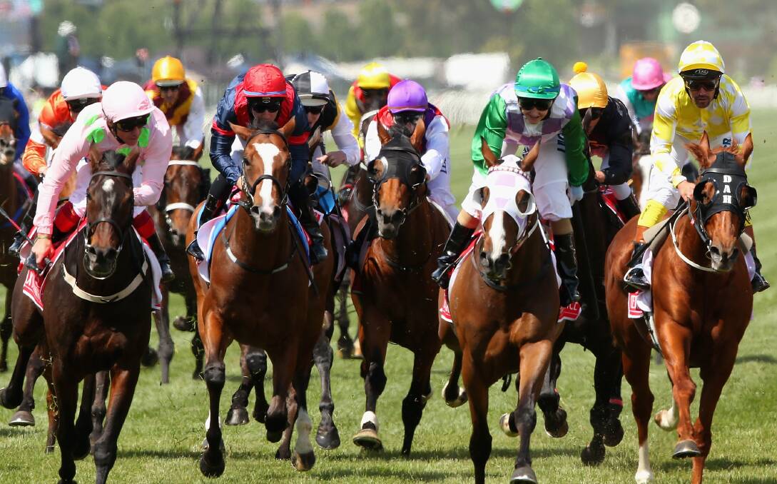 UNLUCKY: Jockey Hugh Bowman (fourth from left, brown and gold silks) finished a distant 20th in yesterday’s Melbourne Cup on Preferment after copping interference in the straight. Photo: GETTY IMAGES 	110315hugh