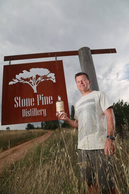 NICE DROP: Stone Pine Distillery owner Ian Glen with his Orange Blossom Gin, which has been chosen as the house gin for an exclusive restaurant at Sydney. Photo: Phil Blatch 	012516pbgin8