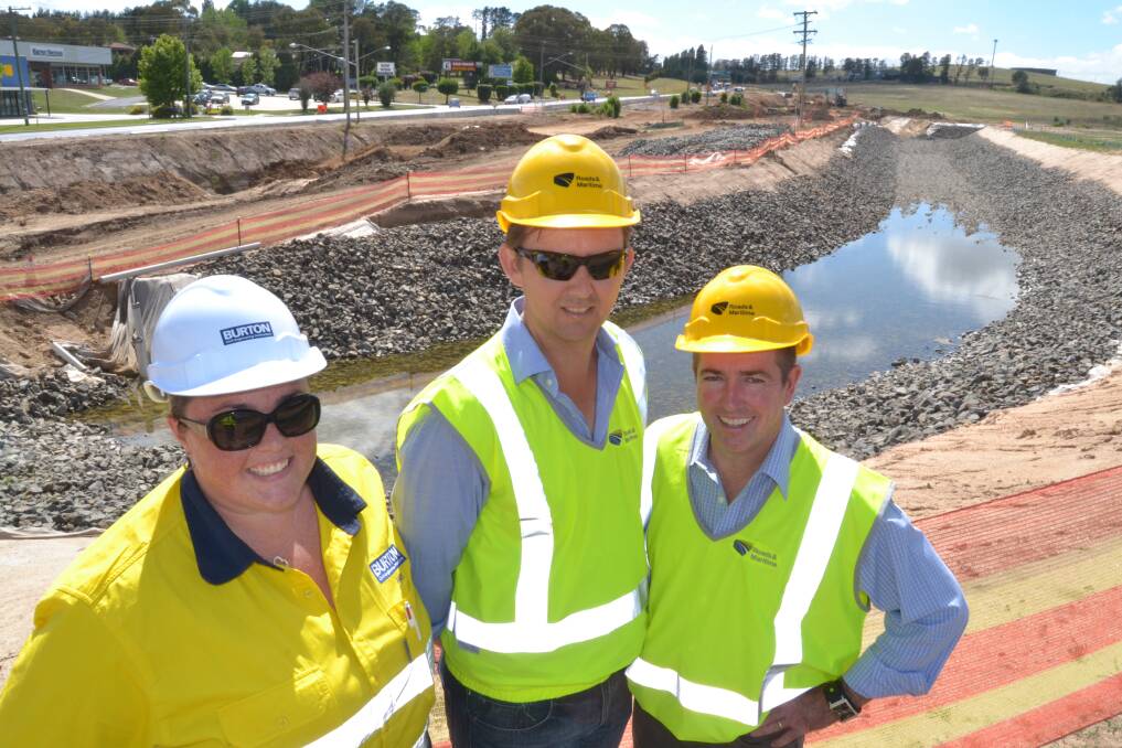 ROAD TO RECOVERY: Amy Bromhead from Burton Contractors, Dion Killiby from Roads and Maritime Services and Bathurst MP Paul Toole take a behind-the-scenes look at progress on the $85 million upgrade of the Sydney Road at Kelso. In the background is the newly-realigned Boyd Creek, which motorists can’t see from the highway.