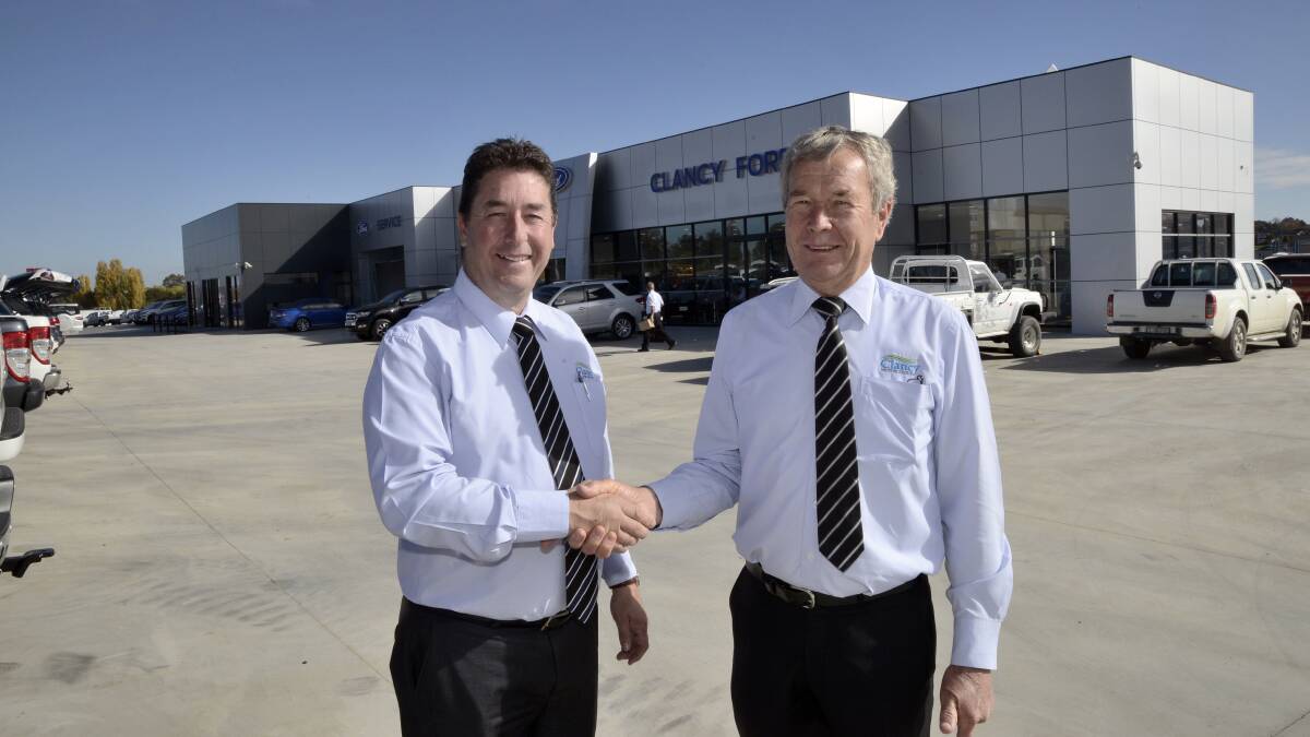 NEW DIGS: Clancy Ford dealer-principal Michael Pentecost with the dealership’s longest-serving employee Jim Hallahan at the brand new site for the business on the outskirts of Bathurst. Photo: PHILL MURRAY 042616pford