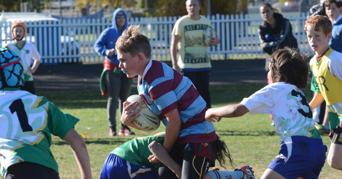 EVEN CONTEST: Tyrese Tilley on the burst for Holy Family in their David Peachey Shield win over the combined Kelso Public/South Bathurst Public team on Tuesday. Photo: PHILL MURRAY 	052416pleague