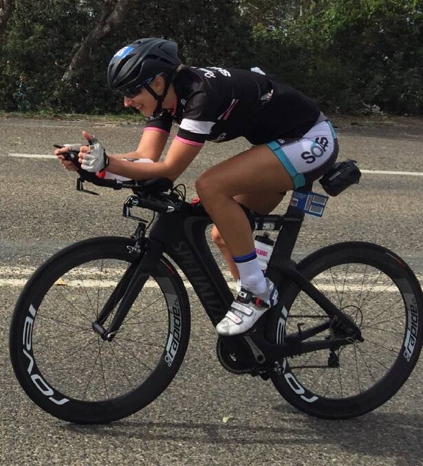 ALMOST THERE: Bathurst’s Peta Cutler battles on in Sunday’s Port Macquarie Ironman, pictured with just 20km of her 180km bike leg remaining.	 050515cutler