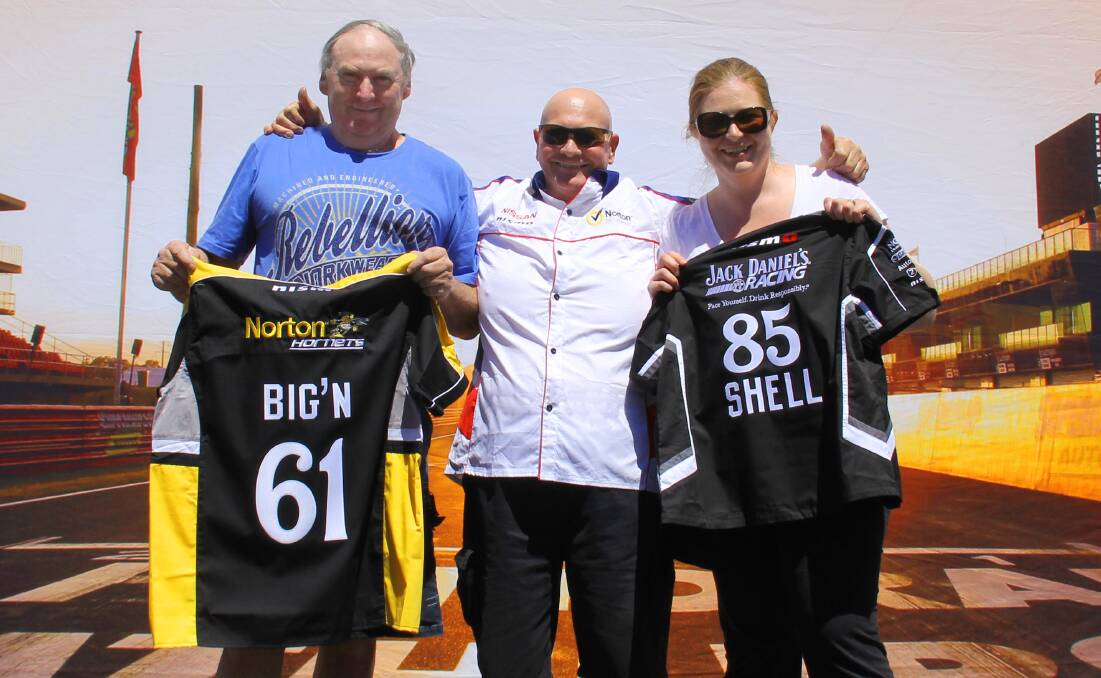 YOU NAME IT: Race fans John Lynch, Geoff Feltham and Michelle Curry love their personalised shirts. 100914advocate2