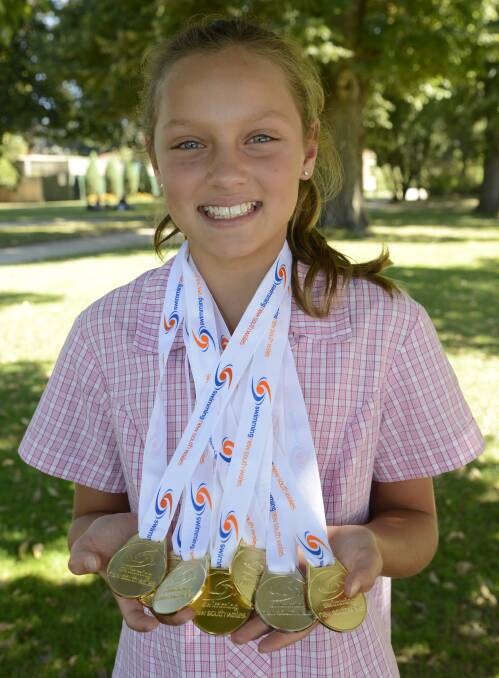 DONE IT AGAIN: Collette Lyons claimed seven medals, six of them gold, at the recent NSW Country Championships. Photo: PHILL MURRAY 022416pcollette