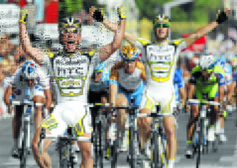 ICONIC MOMENT: Mark Cavendish (front) and Mark Renshaw celebrate their one-two finish in the final stage of the 2009 Tour de France. That year Renshaw assisted Cavendish to five stage wins, an effort which helped the Bathurst talent to be named in the Australian Tour de France team of the century. 072709rens