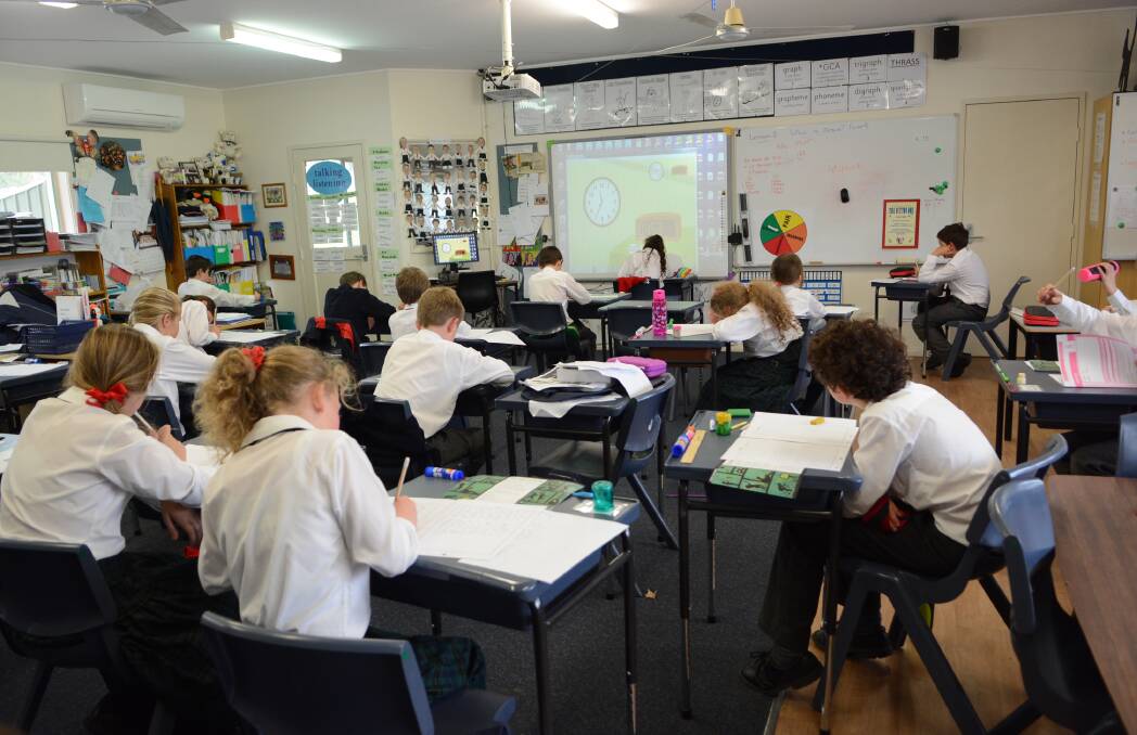 HEADS DOWN: Year 5 students at All Saints’ College sit yesterday’s NAPLAN test. Photo: PHILL MURRAY 051215psaints