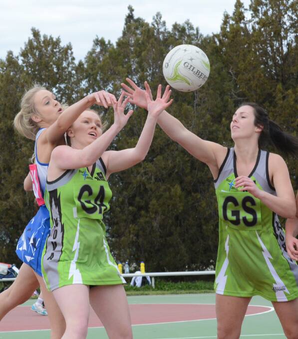 BIG WIN: Sam Thompson (left) battles with Nova Fusion player Olivia Harvey for possession during Collegians Shockwave’s 43-18 win on Saturday. Photo: PHILL MURRAY 080115pnet