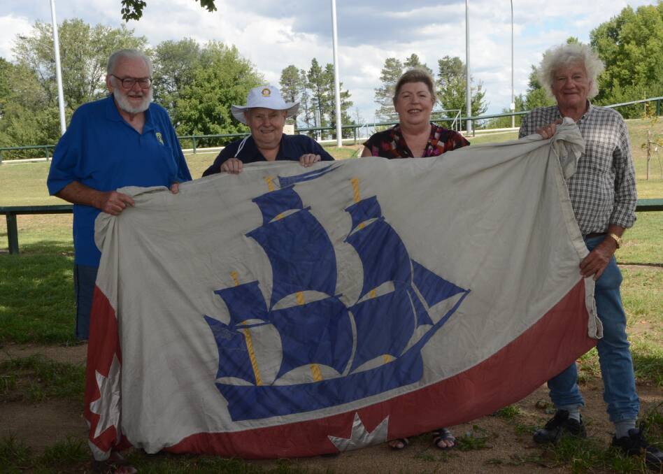 FLY THE FLAG: Bathurst Lions Club members Paul Haysom, Graham Webster, Barbara Andrews and Peter Woods with the Greater City of Sydney flag that can only be flown between Sydney and the Macquarie River. The club would like to see Bathurst now get its own flag. 030315plions