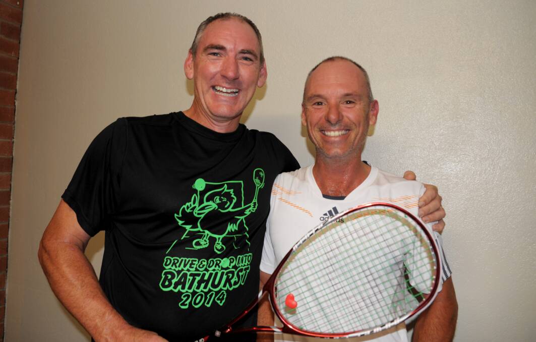 VICTORY: Jeff Bond (left) was too strong for Tony Whackett in the Bathurst Squash Masters division one final. Photo: ZENIO LAPKA 041214zsquash