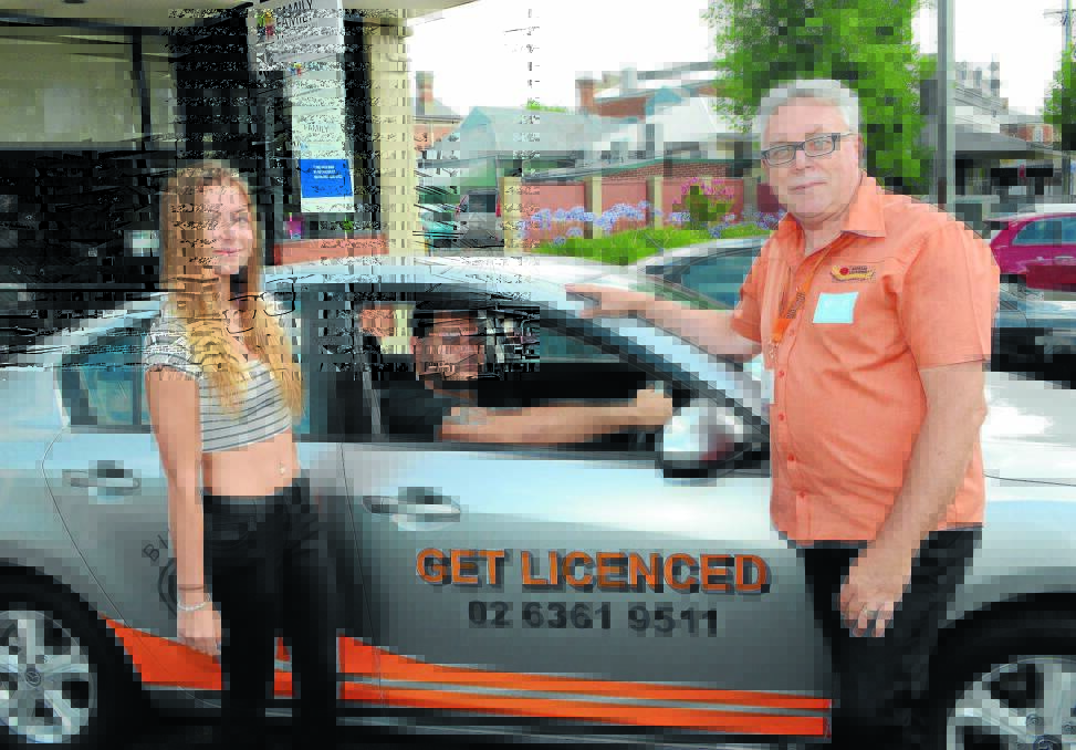 GETTING LICENSED: Birrang Learn to Drive instructor George Bullivant with students Zoi Petford and Ron Wallace who are looking forward to their course. Photo: PHILL MURRAY 010615plearn