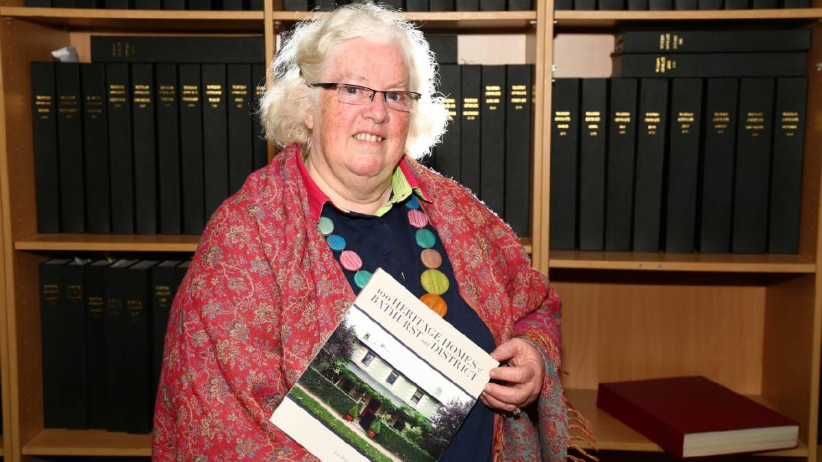 LABOUR OF LOVE: Lee Steele with her new book 100 Heritage Homes Of Bathurst And District. Photo: PHIL BLATCH 	