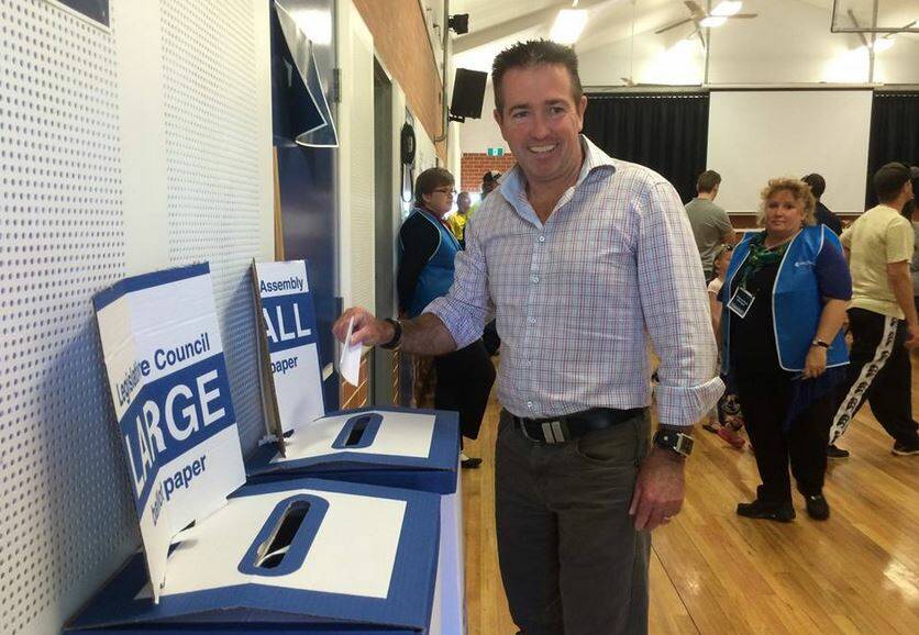 FOUR MORE YEARS: The Nationals' Paul Toole casts his vote at Bathurst Public School today. Photo: ALICE COOMANS