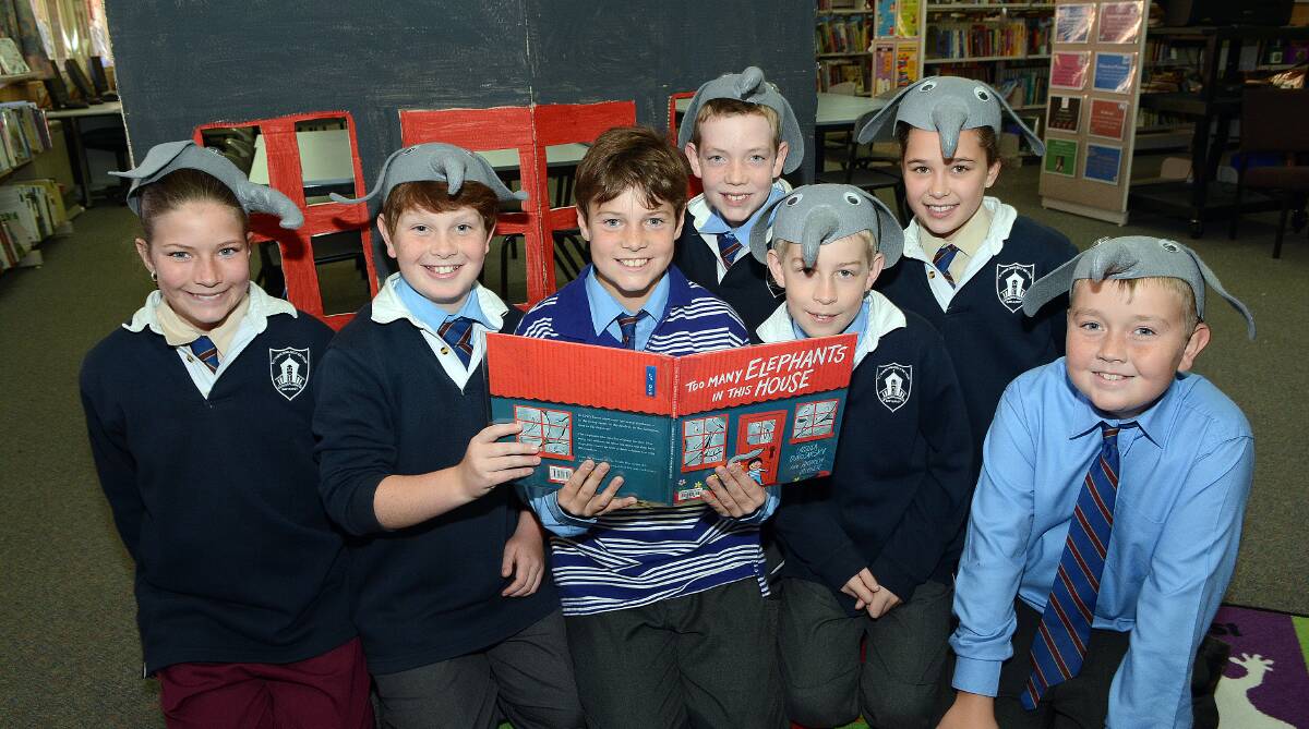 EXCELLENT ELEPHANTS: Charley Fitzpatrick, Angus Cooke, Ryan Harper, Ralph Nicholls, Harrison Davis, Nyssa Henderson and Samuel Parker got dressed up to take part in National Simultaneous Storytime at Cathedral School yesterday. Photo: PHILL MURRAY 052114pelephant